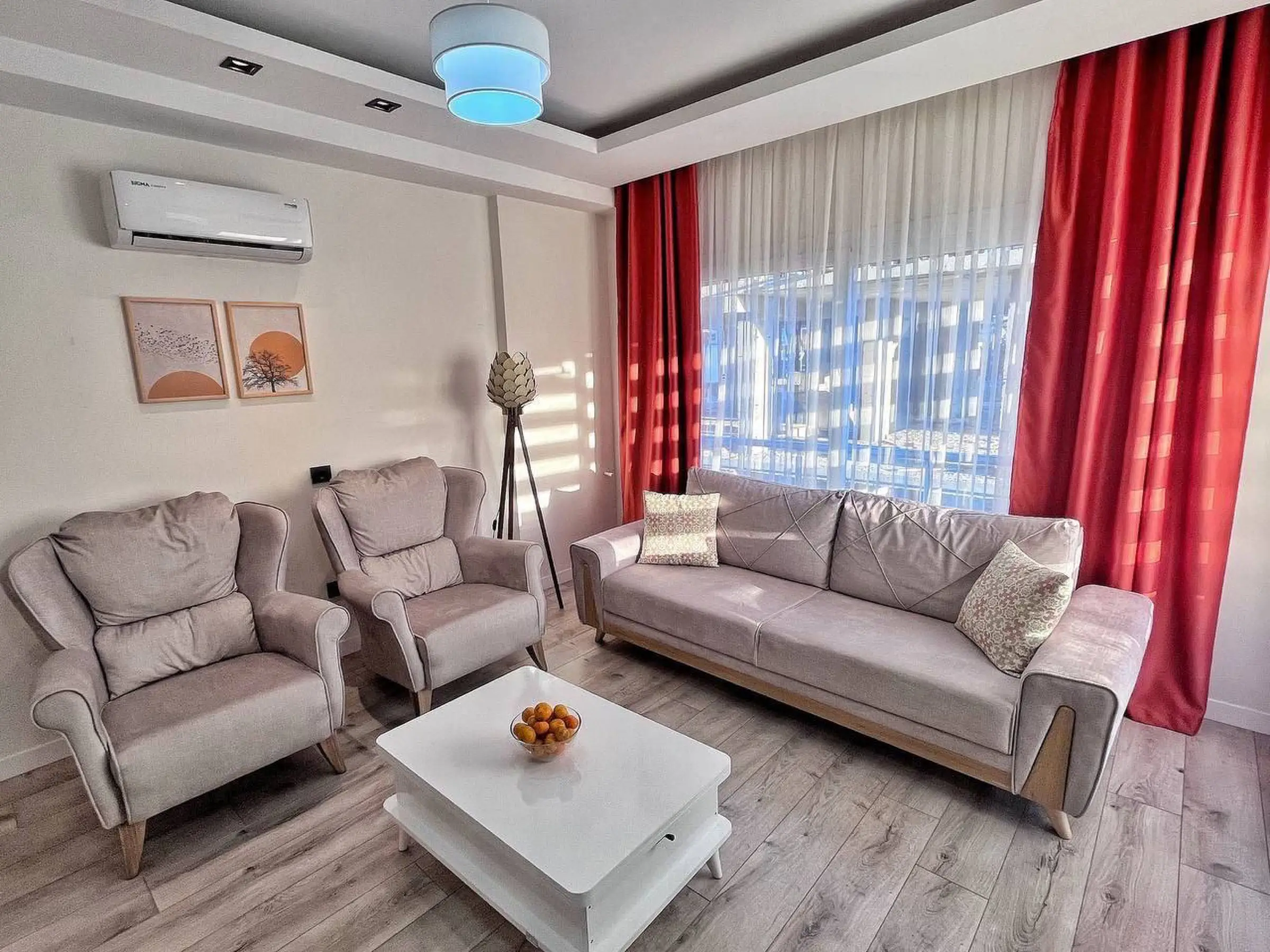 Living room in the evening with the air conditioner above the sofa